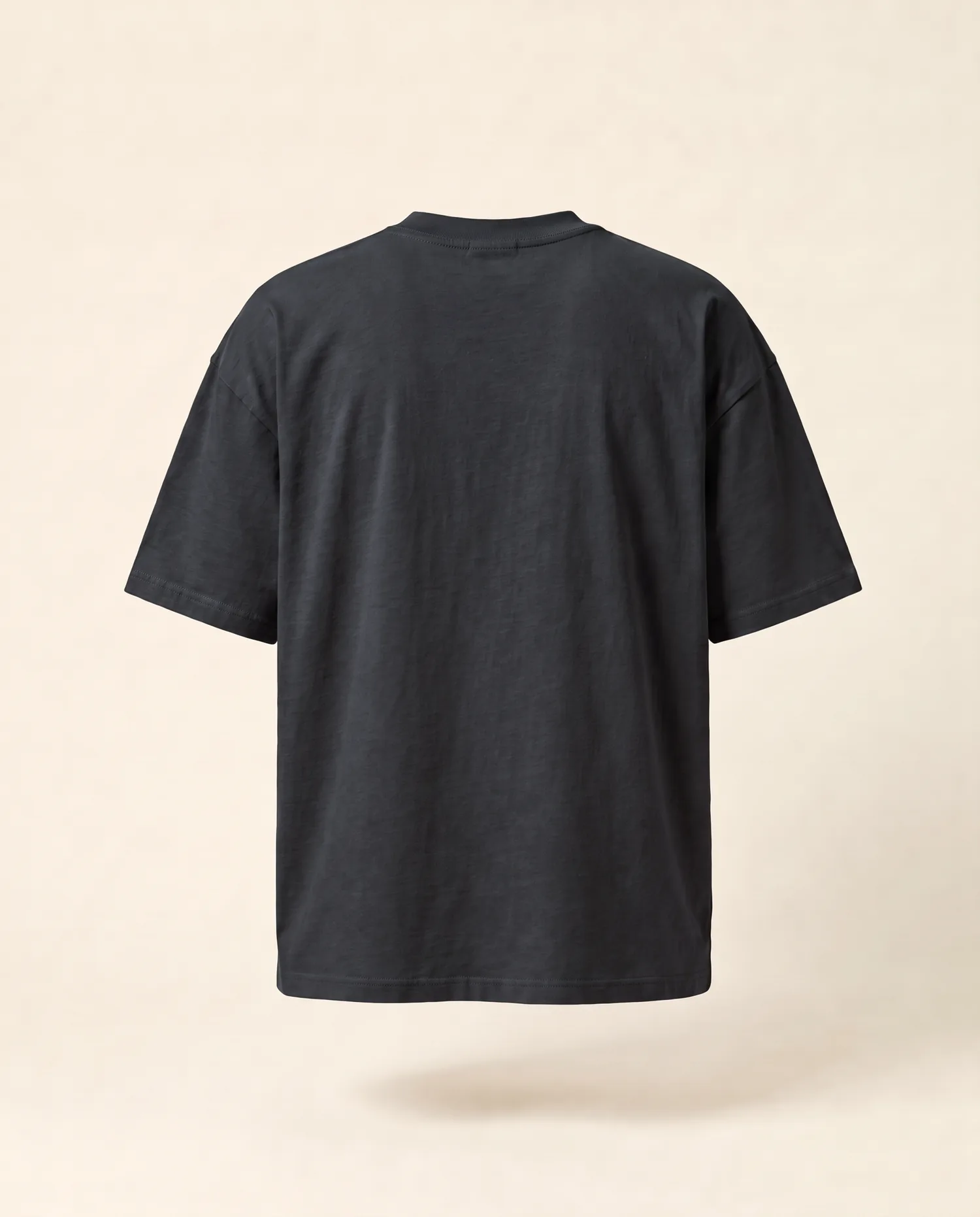 A Tee in Charcoal with Tahuri across the back, back